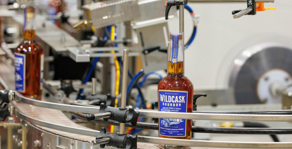 The Bardstown Bourbon Company allowed Beam Institute students to learn the bottling process at their facility. While there, students also packaged and labeled boxes of WildCask for distributors. Photo by Matt Barton